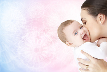 Image showing happy mother kissing adorable baby