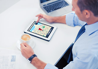 Image showing businessman with tablet pc and coffee in office