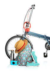 Image showing The new modern bicycle and suitcase, sneakers, thermos