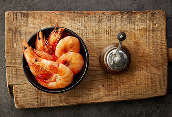 Image showing roasted prawns on wooden cutting board