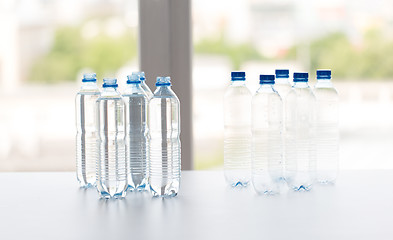 Image showing close up of bottles with drinking water on table