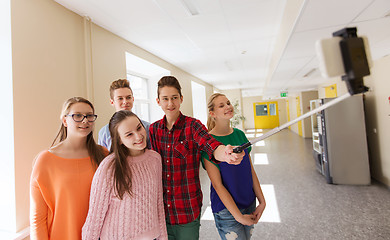 Image showing group of students taking selfie with smartphone