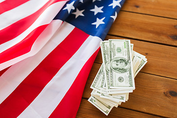 Image showing close up of american flag and dollar cash money