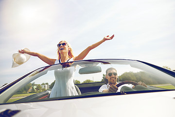 Image showing happy man and woman driving in cabriolet car