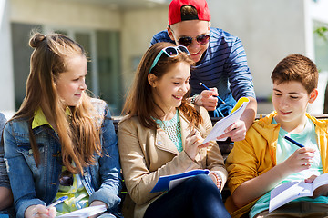 Image showing group of students with notebooks at school yard