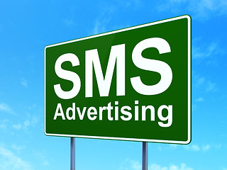 Image showing Advertising concept: SMS Advertising on road sign background