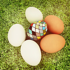 Image showing Eggs and easter eggs on the grass. 3D illustration. Vintage styl