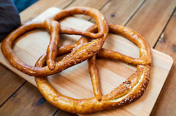 Image showing close up of two pretzels on wooden table