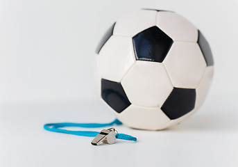 Image showing close up of football or soccer ball and whistle