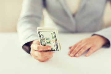 Image showing close up of woman hands holding us dollar money