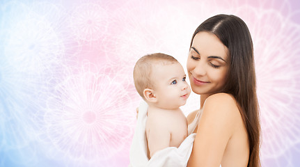 Image showing happy mother holding adorable baby