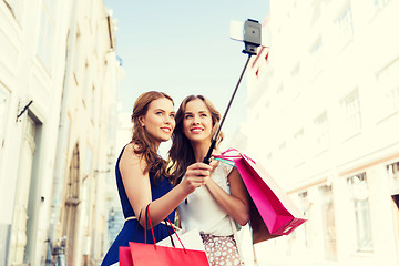 Image showing women shopping and taking selfie by smartphone