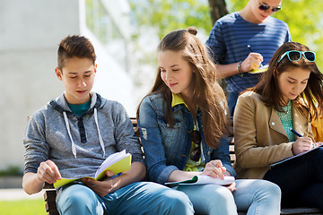 Image showing group of students with notebooks at school yard