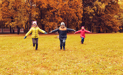 Image showing happy little children running and playing outdoors