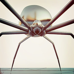 Image showing chrome spider.Close-up. 3D illustration. Vintage style.