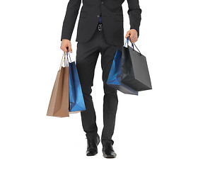 Image showing close up of man in suit with shopping bags