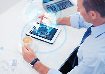 Image showing businessman with tablet pc and coffee in office