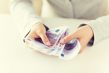 Image showing close up of woman hands counting euro money