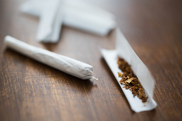 Image showing close up of marijuana joint and tobacco
