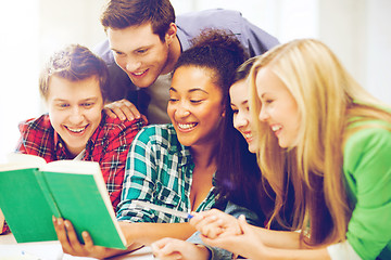 Image showing students reading book at school