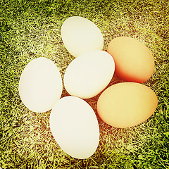 Image showing Eggs on the grass . 3D illustration. Vintage style.