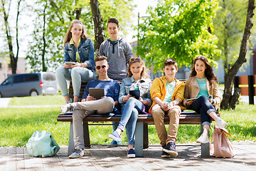 Image showing group of students with tablet pc at school yard