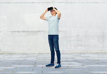 Image showing happy man in virtual reality headset or 3d glasses