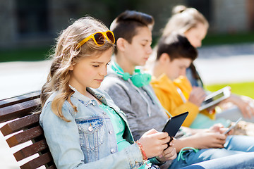 Image showing happy friends with tablet pc computer outdoors