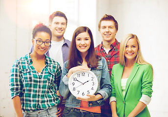 Image showing group of students at school with clock