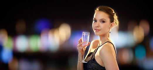 Image showing young asian woman drinking champagne at party