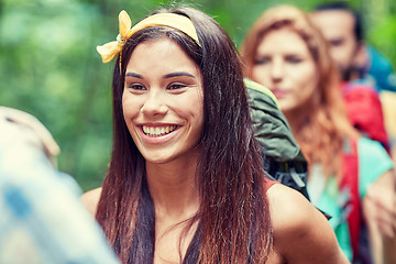 Image showing group of smiling friends with backpacks hiking