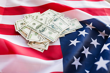 Image showing close up of american flag and dollar cash money