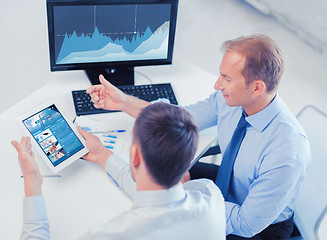 Image showing businessmen with tablet pc and computer at office