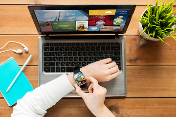 Image showing close up of woman with smart watch and laptop