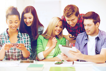 Image showing students looking at smartphones and tablet pc