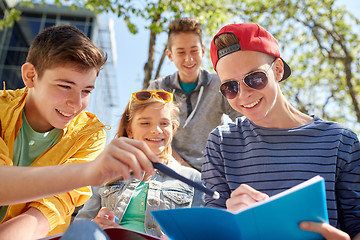 Image showing group of students with notebooks at school yard