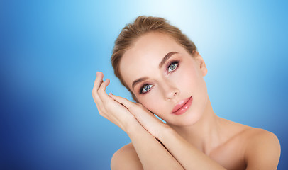 Image showing beautiful young woman face and hands