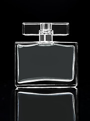 Image showing gray elegant perfume bottle in black background