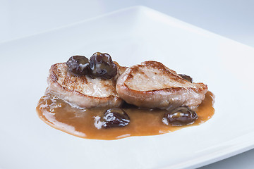 Image showing grilled sirloin with oporto sauce dry grapes