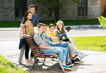 Image showing happy teenage students taking selfie by smartphone