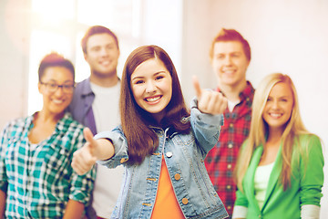 Image showing students showing thumbs up at school