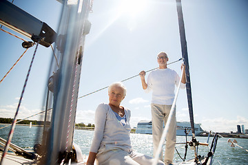 Image showing senior couple hugging on sail boat or yacht in sea