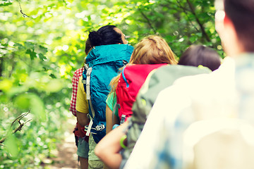 Image showing close up of friends with backpacks hiking