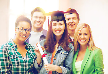 Image showing girl in graduation cap with certificate