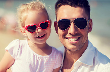 Image showing happy family in sunglasses on summer beach