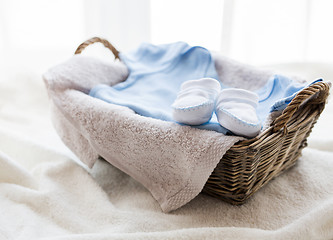 Image showing close up of baby clothes for newborn boy in basket