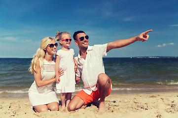 Image showing happy family in sunglasses on summer beach