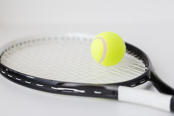 Image showing close up of tennis racket with ball