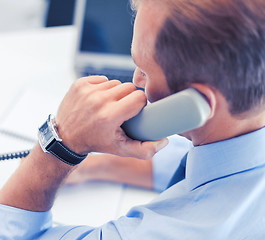 Image showing handsome businessman talking on the phone