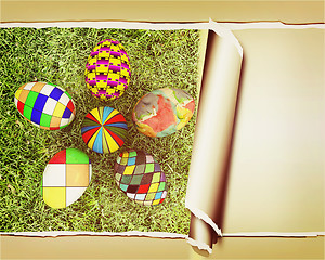 Image showing background of flower of easter eggs on the grass, with torn pape